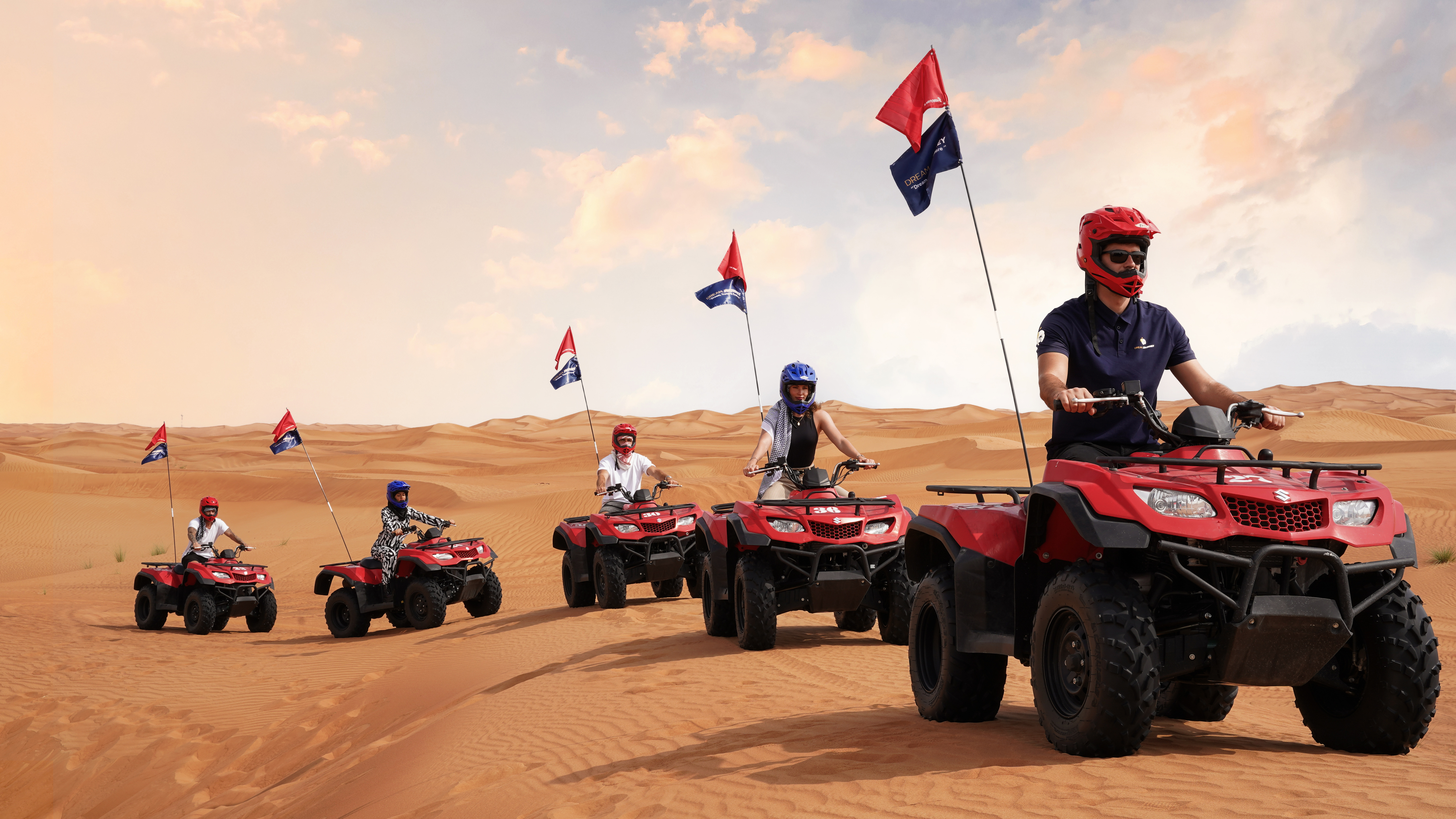 Exciting quad bike ride during small group guided red dune safari with BBQ