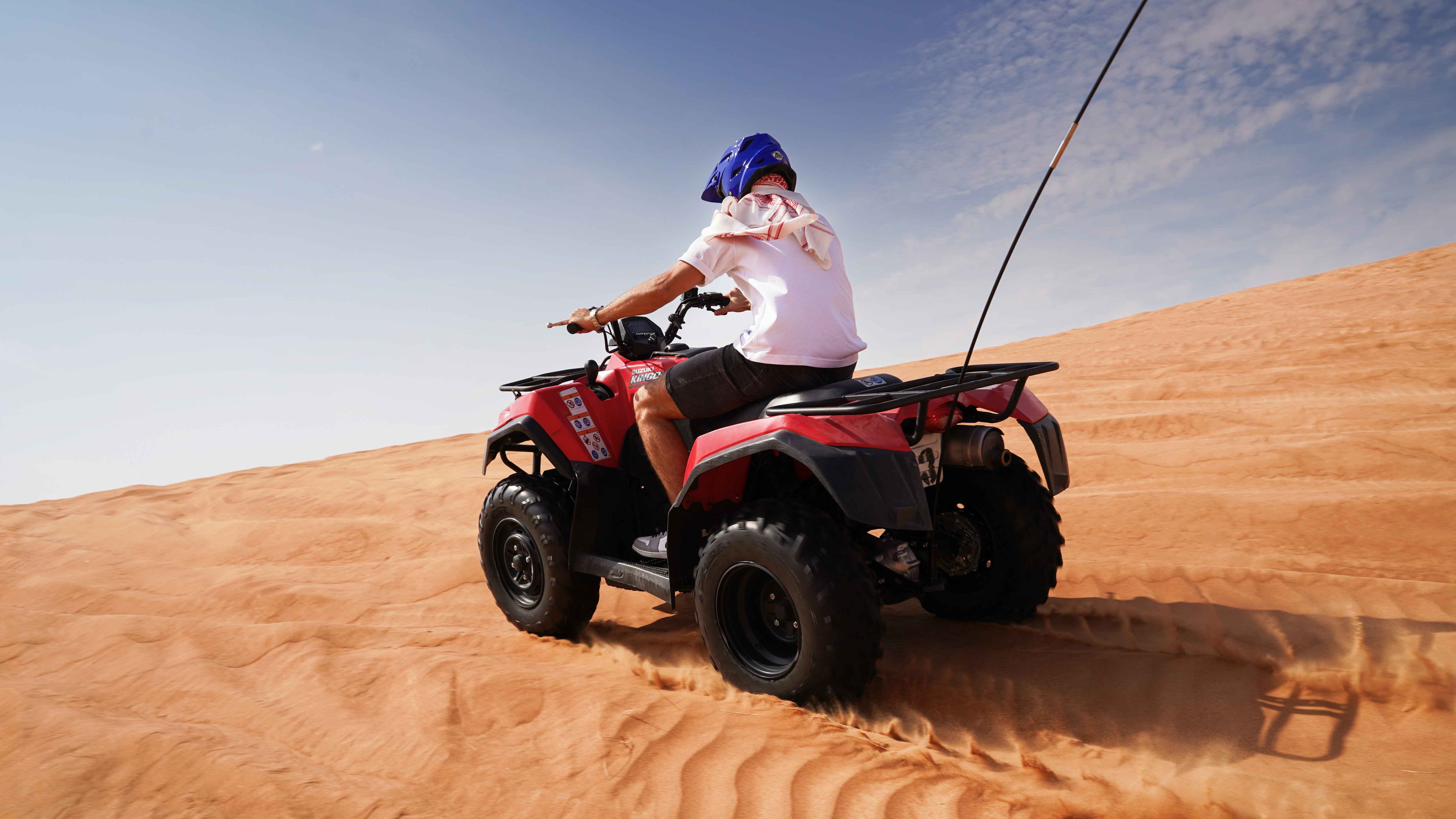 Exciting quad bike ride during small group guided red dune safari with BBQ