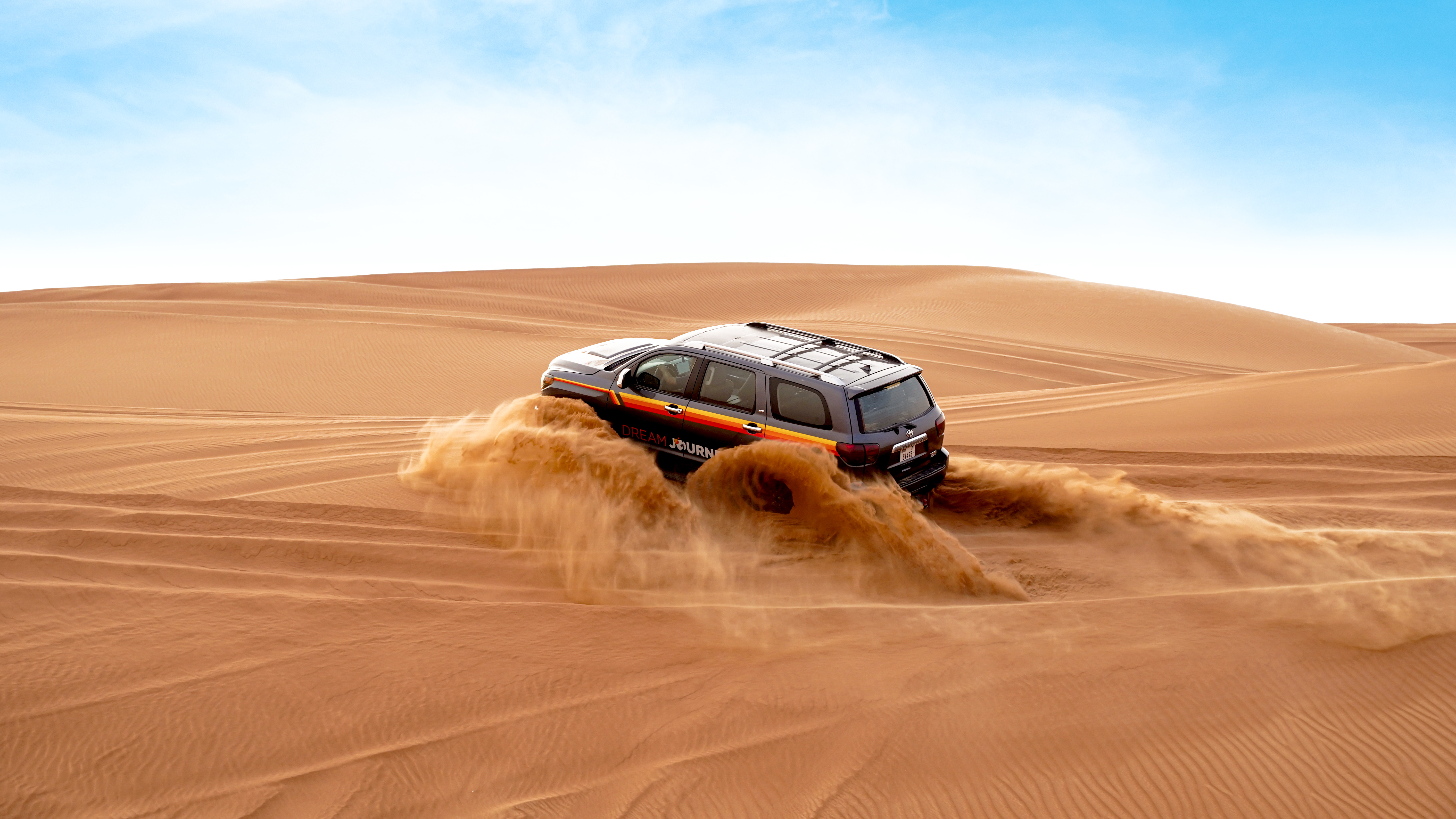 Camel ride in the red dunes of Dubai during a premium safari experience