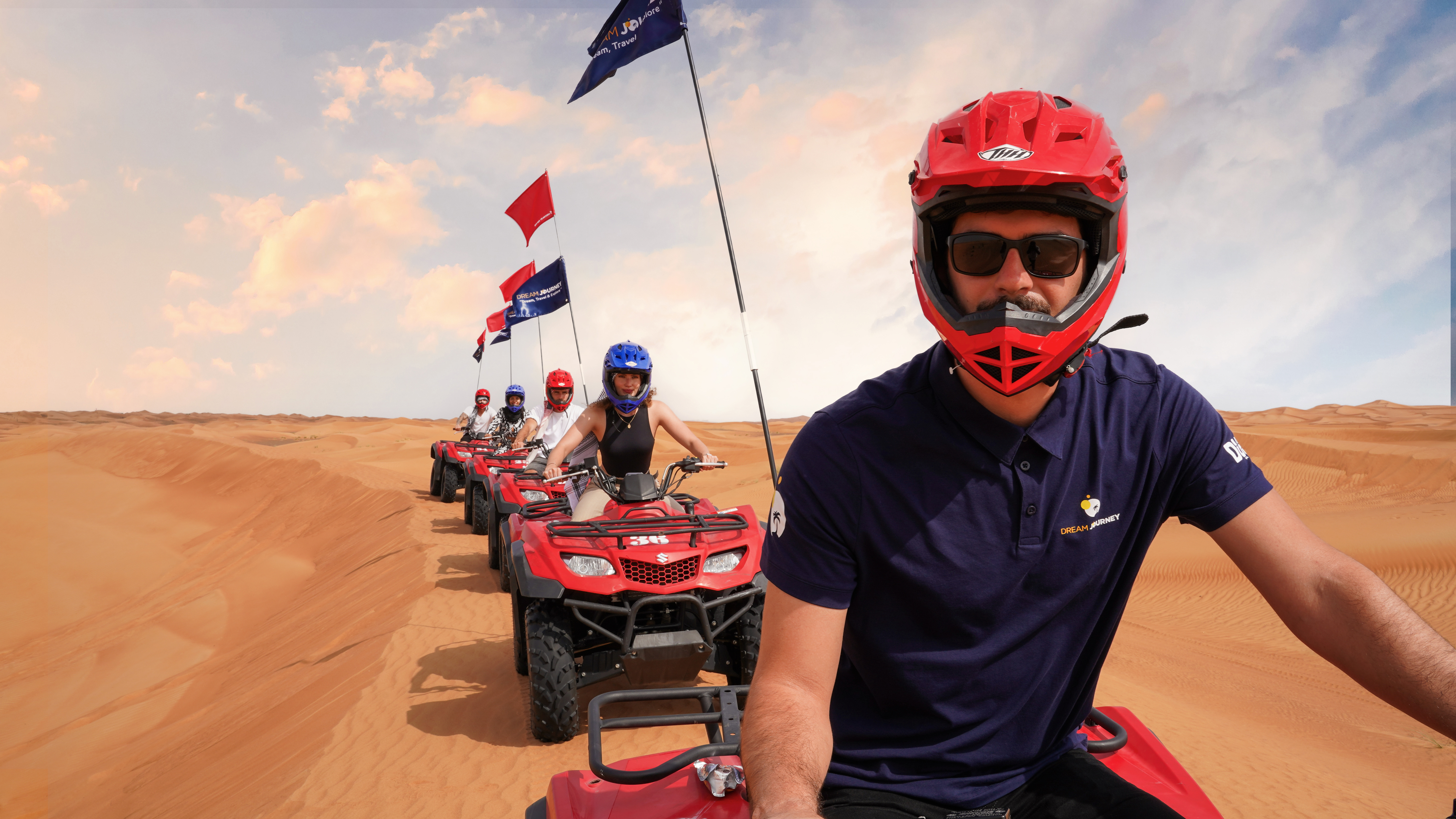 Exciting quad bike ride during small group guided red dune safari with BBQ