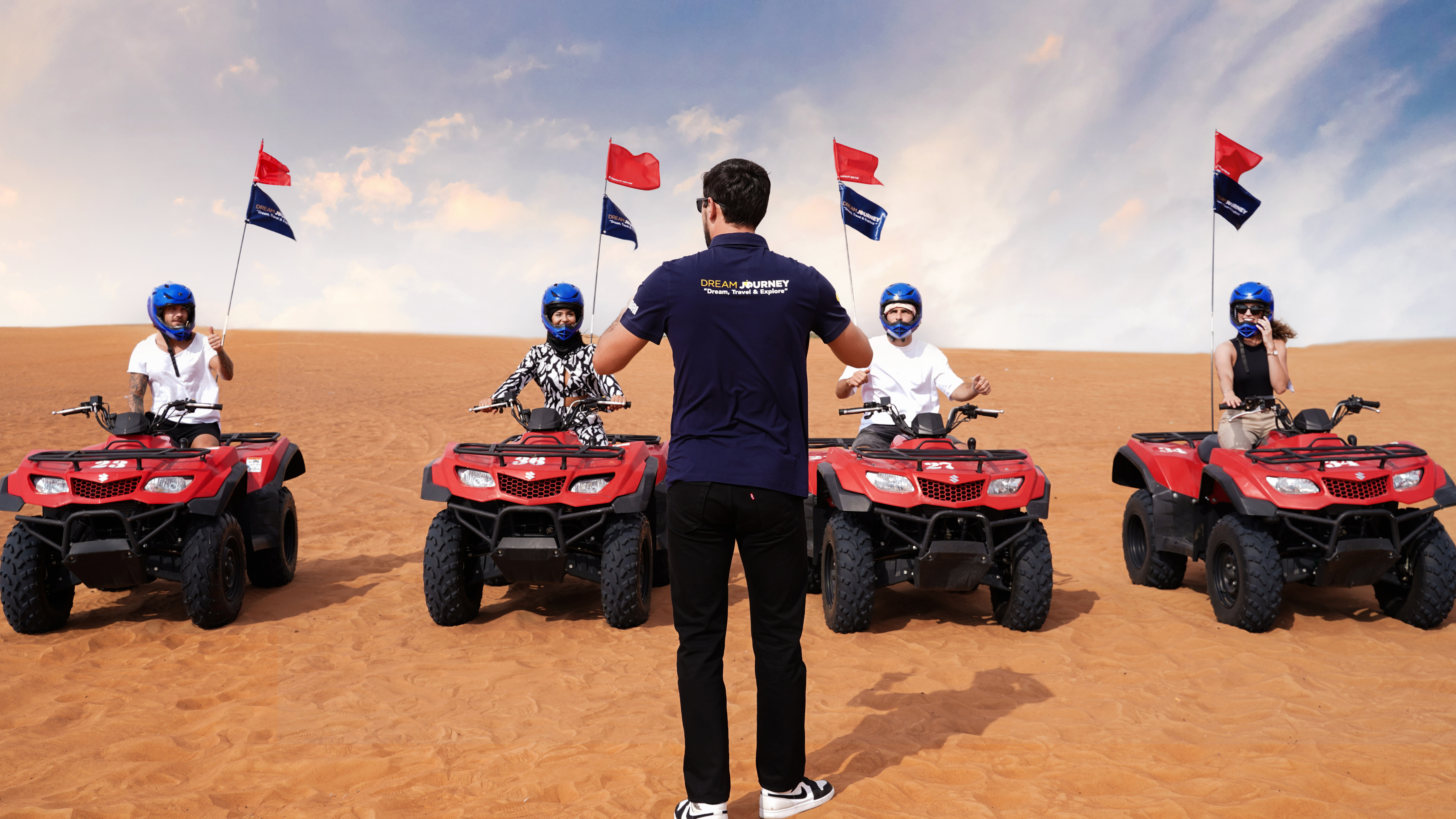 Exciting quad bike ride during small group guided red dune safari with BBQ