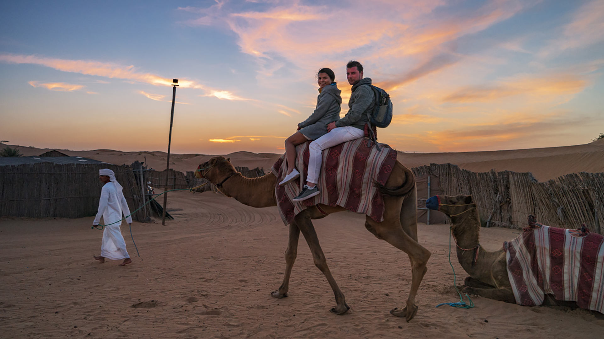 Camel ride in the red dunes of Dubai during a premium safari experience