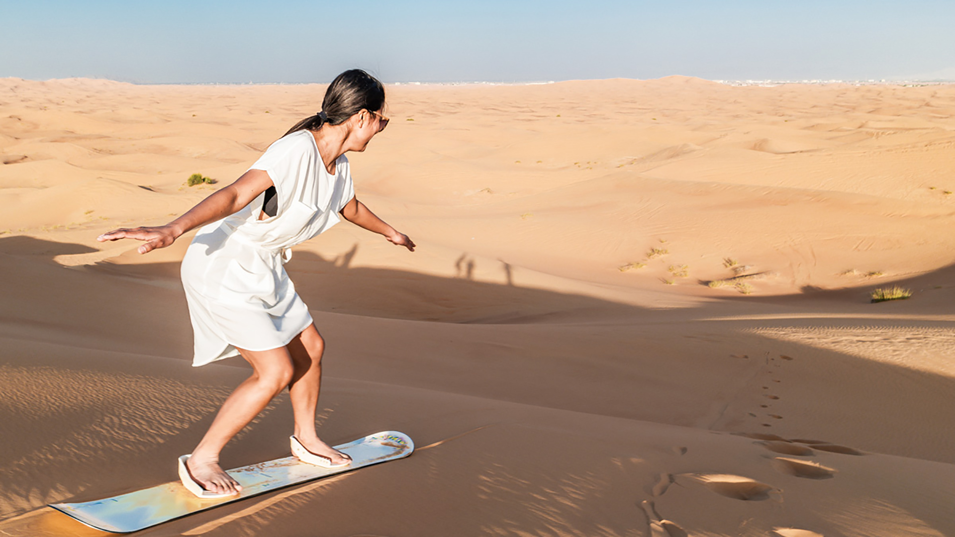 Camel ride in the red dunes of Dubai during a premium safari experience
