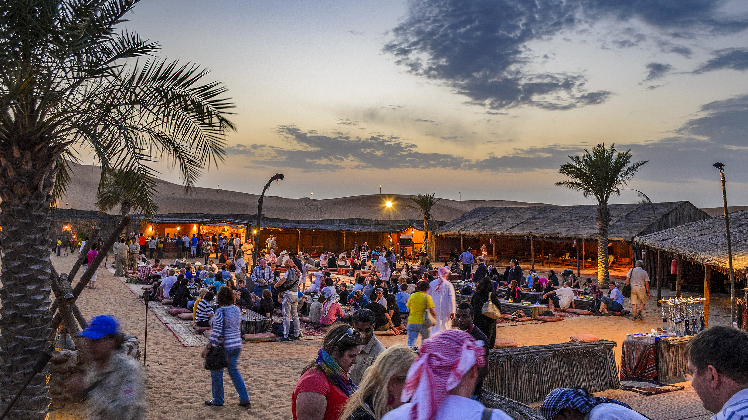 Camel ride in the red dunes of Dubai during a premium safari experience